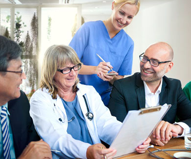 Healthcare professionals reviewing a document